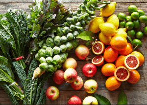 a group of fruits and vegetables on a wood surface Healthy Weight Loss Diets Lowestoft
